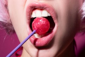 lollipop in/near mouth